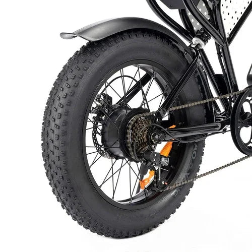Close-up of a bicycle wheel with thick tire on a white background