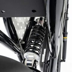 Close-up of a motorcycle suspension system with a white background