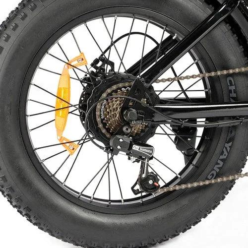 Close-up of a bicycle wheel with a white background